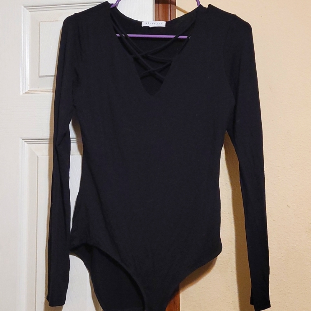 Long-sleeved body suit with criss-cross straps Size small